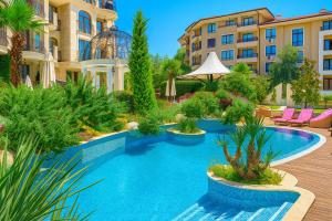 a pool in the middle of a building with plants at Private Apart in Sveti Vlas Harmony Suite in Sveti Vlas +26 photos