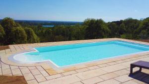 a large swimming pool on top of a patio at Hotel Schloss Leitheim in Leitheim