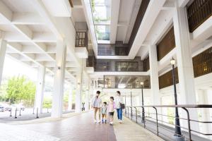 a family walking in a building at Ooedo Onsen Monogatari Hotel Ranpu in Hirado