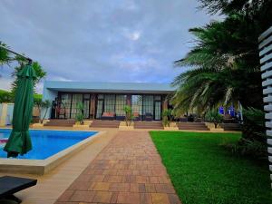a resort with a swimming pool and a building at Dachis Villa Private Pool Retreat in Batumi