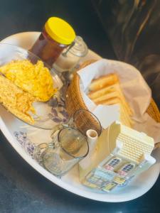a plate of breakfast food with eggs and toast at Comfort corner in Rawalpindi