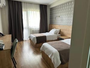 Postel nebo postele na pokoji v ubytování Astana Palace