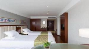 Yitel Collection Hangzhou Binjiang Jiangnan Avenue Baolongcheng客房内的一张或多张床位