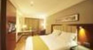 Yitel Collection Hangzhou Binjiang Jiangnan Avenue Baolongcheng客房内的一张或多张床位