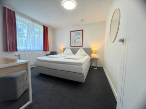 Postel nebo postele na pokoji v ubytování Hotel Altmann