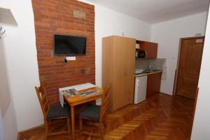Kuchyňa alebo kuchynka v ubytovaní Total Relax Apartmanház