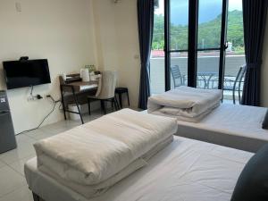 Letto o letti in una camera di Yang