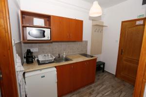 Kuchyňa alebo kuchynka v ubytovaní Total Relax Apartmanház