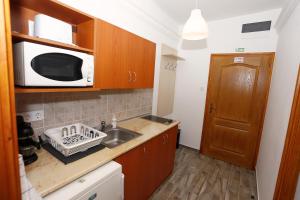 Kuchyňa alebo kuchynka v ubytovaní Total Relax Apartmanház