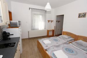 Posteľ alebo postele v izbe v ubytovaní Total Relax Apartmanház