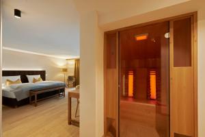 Letto o letti in una camera di Après Post Hotel