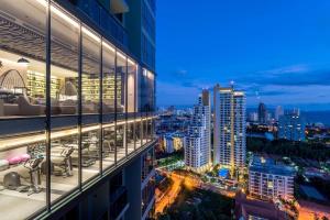 a view of a city at night from a building at Stunning Sea View - Best Place in Pattaya South