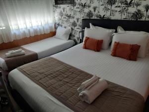 Postel nebo postele na pokoji v ubytování Hôtel Cap Sud Avignon - Réouverture - Ex Kyriad Hôtel