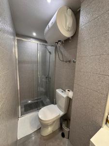 a small bathroom with a shower and a toilet at Guest House Dzakovic Stana in Žabljak +50 photos