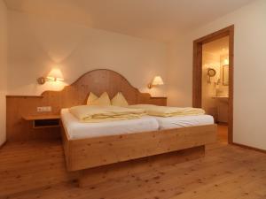 Letto o letti in una camera di Après Post Hotel