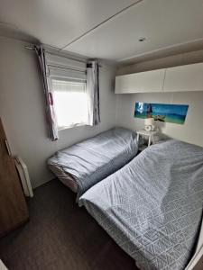 Postel nebo postele na pokoji v ubytování Mobilhome 6 personnes