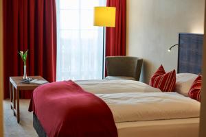 Letto o letti in una camera di Après Post Hotel