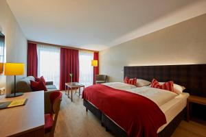 Letto o letti in una camera di Après Post Hotel