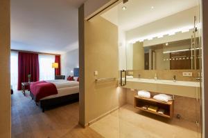 Letto o letti in una camera di Après Post Hotel