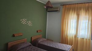 Postel nebo postele na pokoji v ubytování Hotel La Filadelfia