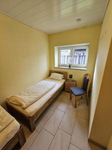 Postel nebo postele na pokoji v ubytování Comfort Apartments SNF zertifiziert - Annemarie Mantke