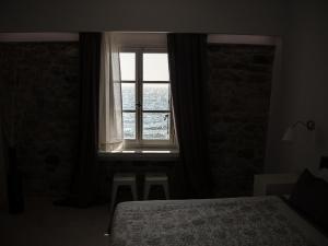 Кровать или кровати в номере Olive Press Hotel & Apartments