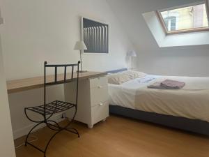 Postel nebo postele na pokoji v ubytování Le Loft, l'annexe