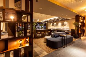 a lobby of a hotel with a bar at Doutonbori Crystal Exe in Osaka