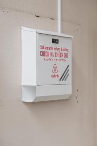 Certifikát, hodnocení, plakát nebo jiný dokument vystavený v ubytování 栄町 ロータリービル