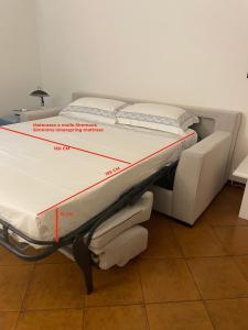 Postel nebo postele na pokoji v ubytování La Terrazza di Villa Ilaria