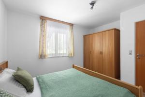 Postel nebo postele na pokoji v ubytování Haus Gletscherblick