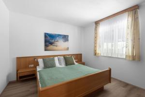 Postel nebo postele na pokoji v ubytování Haus Gletscherblick