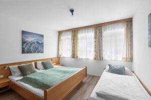 Postel nebo postele na pokoji v ubytování Haus Gletscherblick