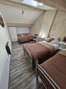 Ένα ή περισσότερα κρεβάτια σε δωμάτιο στο Maison 6 couchages