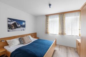 Postel nebo postele na pokoji v ubytování Haus Gletscherblick