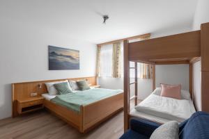 Postel nebo postele na pokoji v ubytování Haus Gletscherblick