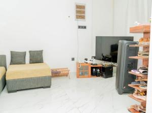 TV a/nebo společenská místnost v ubytování White sand beach Villa