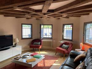 Posezení v ubytování Les chambres de la Vaulx-Renard