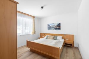 Postel nebo postele na pokoji v ubytování Haus Gletscherblick