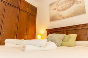 Posteľ alebo postele v izbe v ubytovaní Casa El Lance | +Patio y Paseo Marítimo