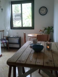 a wooden table with a bowl on top of it at Hostal Casa Amaya in Vallehermoso +22 photos