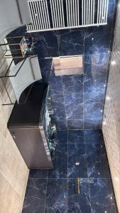 an overhead view of a blue tiled floor at Spa home, Hammam in Prénouvellon +4 photos