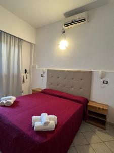 Postel nebo postele na pokoji v ubytování Hotel Anthos