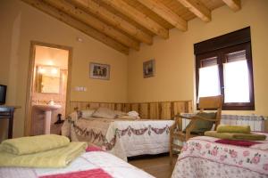 Postel nebo postele na pokoji v ubytování Casa Rural Duquesa De La Conquista de Ávila