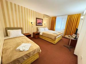 Postel nebo postele na pokoji v ubytování Central Hotel & Restaurant