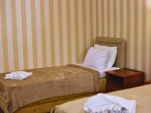 Postel nebo postele na pokoji v ubytování Central Hotel & Restaurant