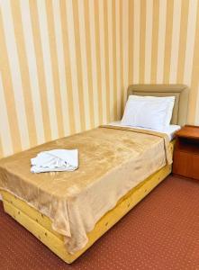 Postel nebo postele na pokoji v ubytování Central Hotel & Restaurant