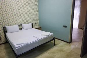 Postel nebo postele na pokoji v ubytování Senat Hotel