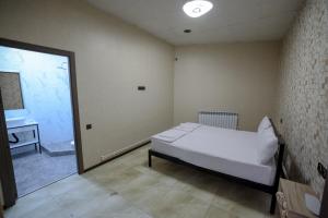 Postel nebo postele na pokoji v ubytování Senat Hotel