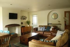 a living room with a couch and a table at Mousetrap in Wells next the Sea